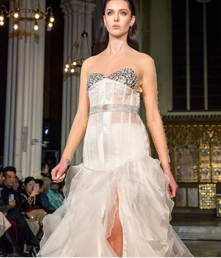 Cloud white structured corset gown with layered organza ruffles from Saanjh by Saloni London Fashion Week 2026 collection