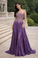 Lilac couture gown by Saanjh by Saloni featuring a structured embroidered corset bodice and flowing pleated skirt from the Cloud Devotion collection.